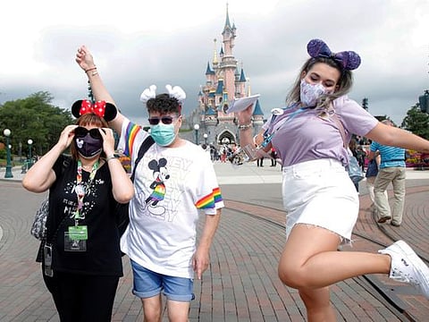 Masks and Mickey: Disneyland Paris reopens after four-month closure 
