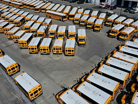 School buses sit parked in a lot at First Student Charter Bus Rental on July 14, 2020 in San Francisco, California.