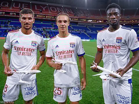 Olympique Lyon players display their new jersey ahead of their friendly match against Glasgow Rangers FC at the Groupama Stadium on Thursday night.