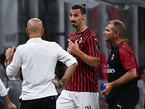 AC Milan’s Zlatan Ibrahimovic argues with coach Stefano Pioli after his substitution