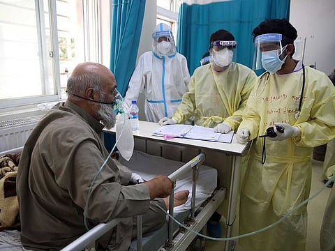 A patient is connected to an oxygen tank in the Intensive Care Unit ward for COVID-19 patients at the Afghan-Japan Communicable Disease Hospital in Kabul, Afghanistan, Tuesday, June 30, 2020. 