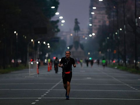 A man jogs during a government-ordered lockdown to curb the spread of the new coronavirus in Buenos Aires, Argentina, Monday, July 20, 2020. 