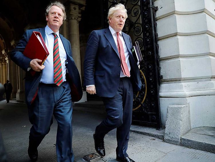 Britain's Prime Minister Boris Johnson (R) and Britain's Scotland Secretary Alister Jack London