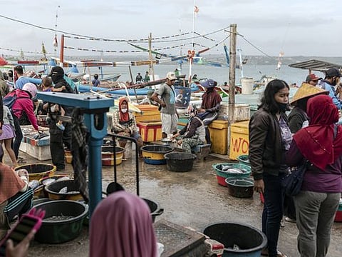 A fish market in Kuta, Bali, Indonesia, on July 6, 2020. Many resort workers have gone home to villages and small towns, taking up traditional ways of earning a living to feed themselves and their families.