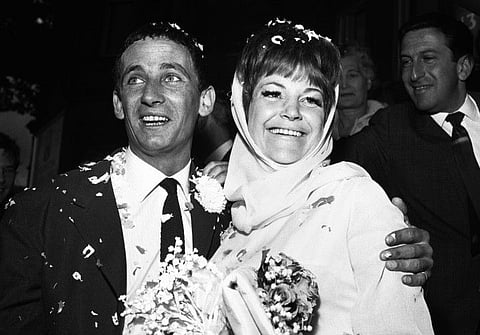 British Jazz singer Annie Ross (right) and actor Sean Lynch are covered with confetti after their marriage on August 19, 1963, in London.
