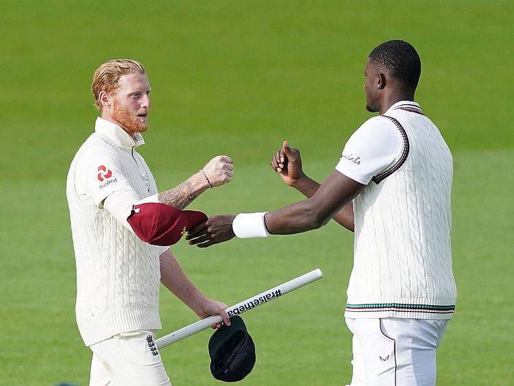 West Indies' captain Jason Holder, right, congrqatulates England's Ben Stokes after their win on the last day of the second Test