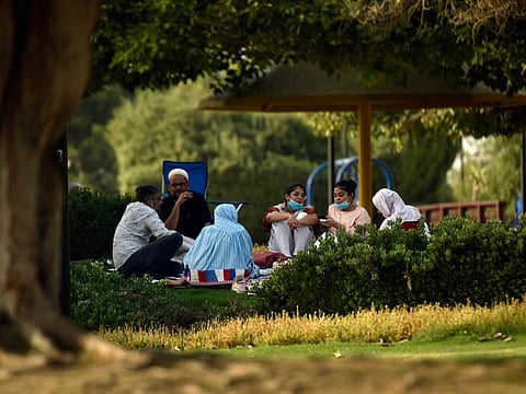A family enjoys a day out in the sun at Umm Suqaim Park in Dubai earlier. Dubai Municipality inspectors visited the park on Friday to ensure compliance with health protocol and safety measures.