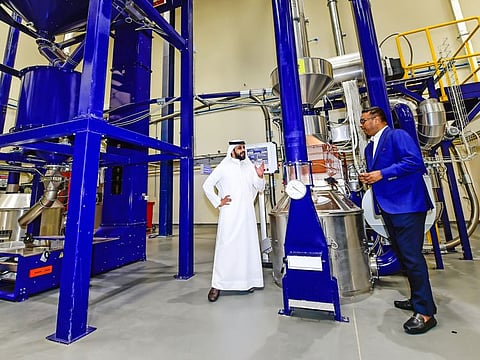 Ahmed Bin Sulayem, Executive Chairman and Chief Executive Officer and Sanjeev Dutta, Executive Director - Commodities & Financial Services at the coffee testing section of DMCC Coffee Centre in Jebel Ali.