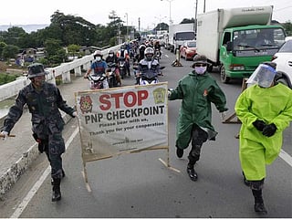 Manila back under lockdown as COVID-19 cases surge