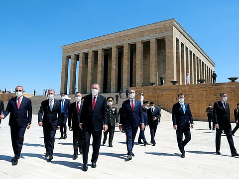 Turkey's President Recep Tayyip Erdogan, foreground centre, ministers and army commanders visit the mausoleum of modern Turkey's founder Mustafa Kemal Ataturk before a meeting of the High Military Council in Ankara on July 23, 2020. Erdogan joined top commanders for one of the military's most important meetings to promote officers or dismiss others for disciplinary reasons. 