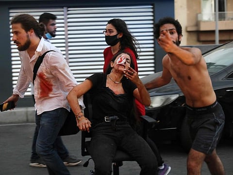 Wounded people outside a hospital following Tuesday's explosion in Beirut.