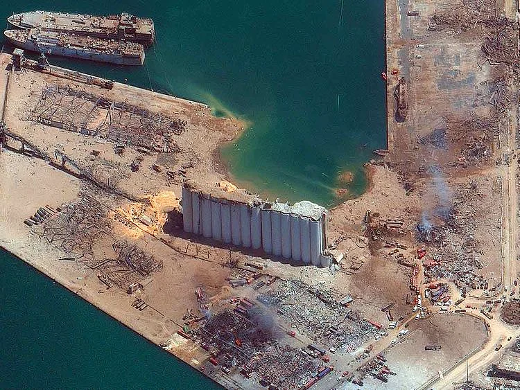 This satellite image provided by Maxar Technologies shows the port of Beirut in Lebanon on Wednesday, Aug. 5, 2020, the day after a massive explosion that left entire city blocks blanketed with glass and rubble.