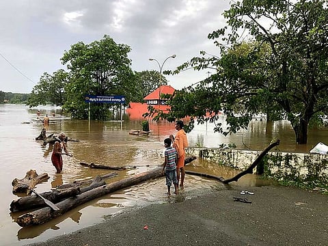 Floodwaters surround the Shiva temple Aluva as the entire district is under red alert for likely heavy rainfall at Ernakulam district, in Kochi on Friday.
