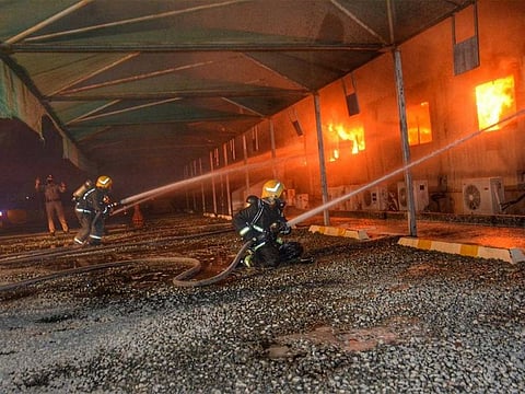 Firemen battle a blaze next to a train station in the Saudi city of Jeddah.