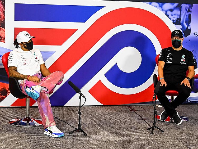 Mercedes' drivers Lewis Hamilton and Valtteri Bottas discuss the 70th Anniversary Grand Prix at Silverstone 