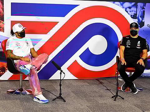 Mercedes' drivers Lewis Hamilton and Valtteri Bottas discuss the 70th Anniversary Grand Prix at Silverstone 
