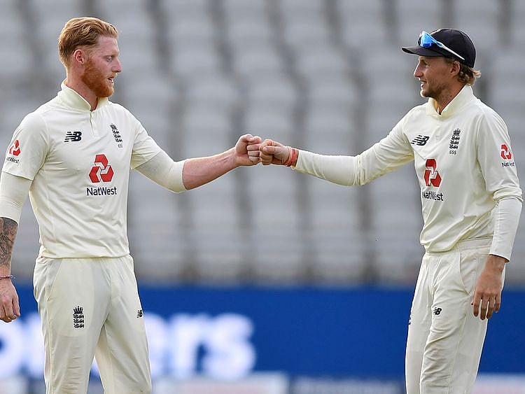 England captain Joe Root, right, fist bumps with teammate Ben Stokes at the end of the third day of the Test match against Pakistan at Old Trafford 