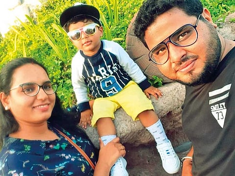 Rohit Kumar with his wife and son. The family has been stranded in India since March 8, 2020.