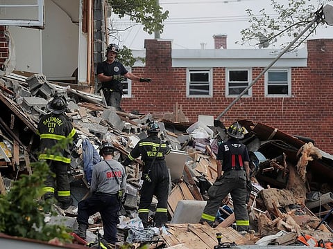 Rescue workers are seen at the scene of an explosion in a residential area of Baltimore, Maryland, U.S., August 10, 2020.