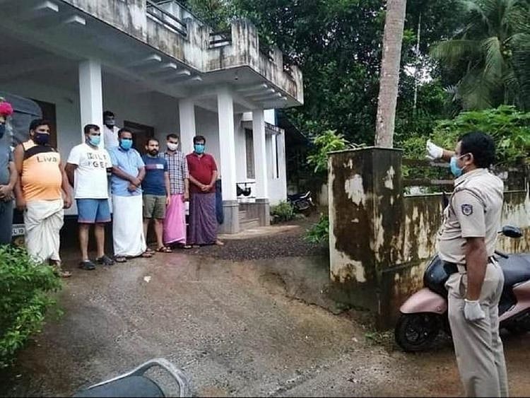 Kerala cop saluting volunteers 