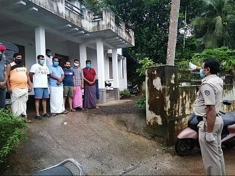 Kerala cop saluting volunteers 