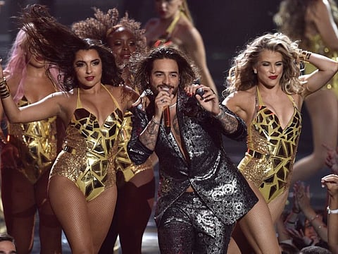 Maluma, center, performs at the MTV Video Music Awards in New York on August 20, 2018.