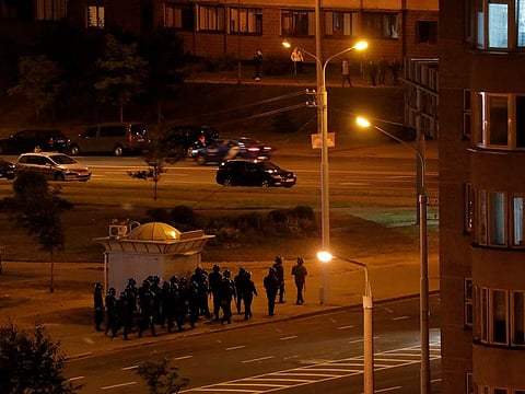 Belarusian law enforcement officers patrol the streets as people protest against the presidential election results, in Minsk, Belarus August 12, 2020.