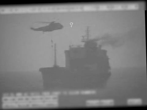 In this image made from video released by the U.S. military's Central Command, Iranian commandos fast-rope down from a helicopter onto the MV Wila oil tanker in the Gulf of Oman off the coast of the United Arab Emirates on Wednesday, Aug. 12, 2020. 