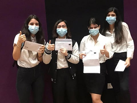 GEMS First Point School students celebrate their A level results on Thursday.