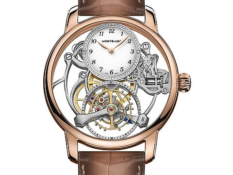 Time is displayed on an 18K gold dial with grand feu enamel coating. Slim rose gold hands sweep the dial printed with Breguet style Arabic numerals.