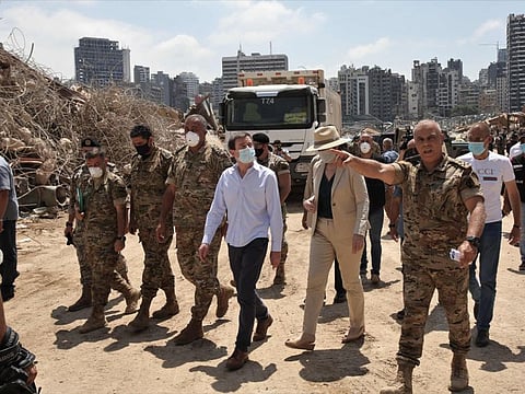 US Undersecretary of State for Political Affairs David Hale (3rd from right) and US Ambassador to Lebanon Dorothy Shea (2-R), accompanied by Lebanese army officers, tour at the site of last week's explosion that hit the seaport of the Lebanese capital Beirut, on August 15, 2020. - Hale today called for a transparent and credible probe into the explosion at Beirut's port, as FBI investigators were set to arrive in Lebanon to assist authorities. (Photo by NABIL MOUNZER / POOL / AFP)