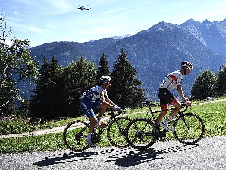 Team Deceuninck riderJulian Alaphilippe and Team UAE Emirates' David De la Cruz climb during the fourth stage of the 72nd edition of the Criterium du Dauphine 