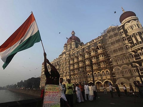 A man waves the Indian tricolour in Mumbai, India