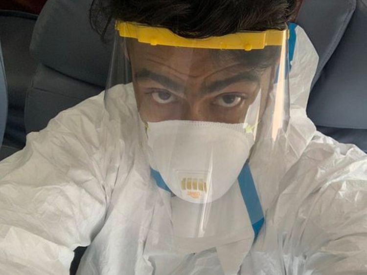 Delhi Capitals' Ravichandran Ashwin in full protective geat on the flight to the UAE