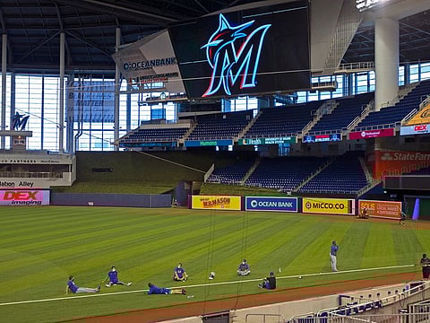 New York Mets players stretch before a baseball game against the Miami Marlins at Marlins Park in Miami, Thursday, Aug. 20, 2020. 