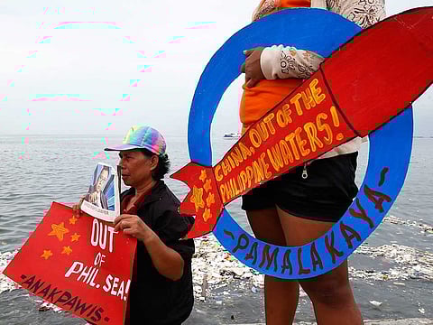 Demonstrators continue to protest China over its coast guards' seizure of fish caught by Filipino fishermen near the contested Scarborough Shoal