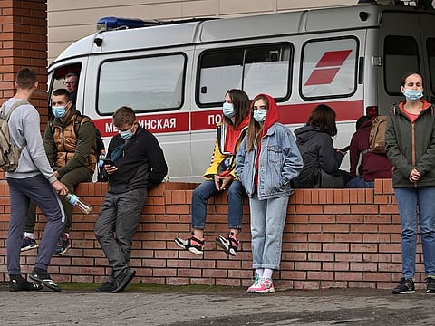 People gather outside a hospital, where Russian opposition leader Alexei Navalny receives medical treatment in Omsk, Russia August 21, 2020.