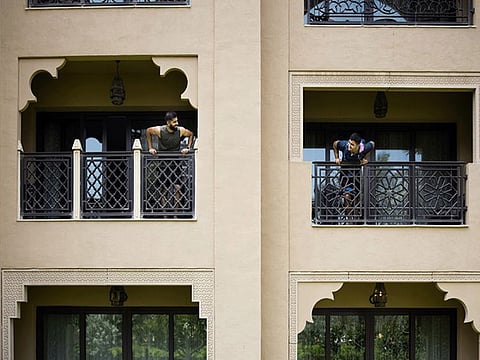 Two Rajasthan Royals players chat up from balconies of their hotel rooms in Dubai. The teams are undergoing a six-day quarantine before they get down to practice for IPL 2020.