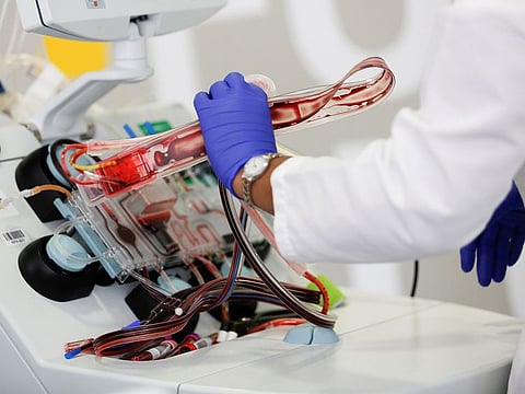 Phlebotomist Jenee Wilson takes apart an aphaeresis kit after processing a convalescent plasma donation from a recovered coronavirus (COVID-19) patient at the Central Seattle Donor Center of Bloodworks Northwest during the outbreak in Seattle, Washington, U.S. April 17, 2020.
