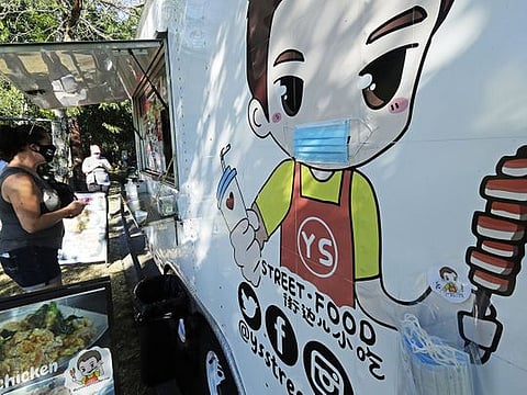 Food trucks hit by virus find new foodies