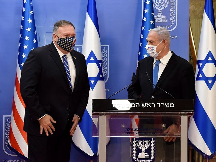 U.S. Secretary of State Mike Pompeo, left, and Israeli Prime Minister Benjamin Netanyahu wear face masks to help prevent the spread of the coronavirus after they make joint statements to the press, in Jerusalem, Monday, Aug. 24, 2020.