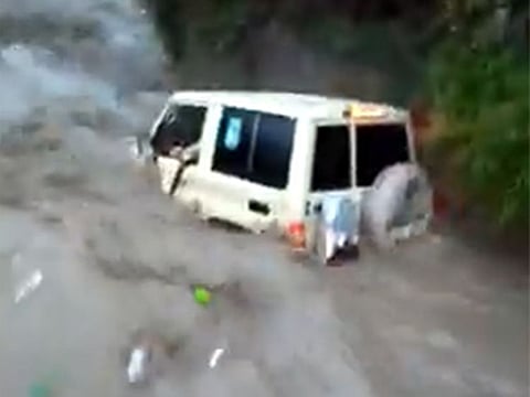 The vehicle in which the people were swept away.