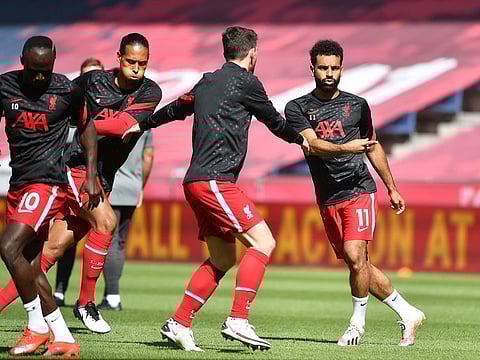 Liverpool's Mo Salah, Andrew Robertson, Virgil van Dijk and Sadio Mane warm up before the RB Salzburg match.
