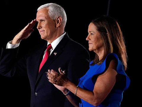 US Vice-President Mike Pence salutes on stage with his wife Karen after speaking on the third day of the Republican National Convention at Fort McHenry National Monument and Historic Shrine in Baltimore, Wednesday, Aug. 26, 2020. 
