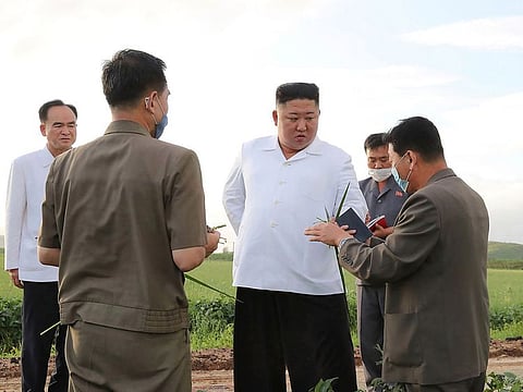 In this undated photo provided on Friday, Aug. 28, 2020, by the North Korean government, North Korean leader Kim Jong Un, center, visits a western coastal area in South Hwanghae province, North Korea, where Typhoon Bavi made landfall early Thursday, Aug. 27.