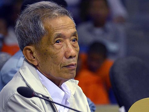 This file handout photo taken on February 3, 2012 and released by the Extraordinary Chamber in the Courts of Cambodia (ECCC) shows former Khmer Rouge prison chief Kaing Guek Eav, better known as Duch, sitting in the courtroom at the ECCC in Phnom Penh. The former chief interrogator and torturer for Cambodia's genocidal Khmer Rouge regime died early on September 2, 2020 in hospital in Phnom Penh. 