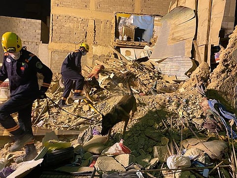 Civil defence personnel work at the site of a collapsed house in Riyadh.