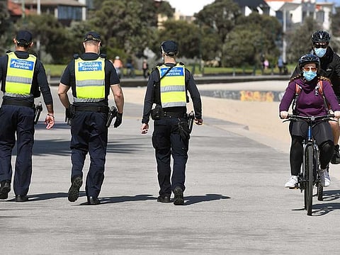 Protective services officers patrol along the St Kilda Beach foreshore in Melbourne on September 3, 2020 as the city battles an outbreak of the Covid-19 coronavirus. he state of Victoria has been under strict lockdown for over a month after a resurgence of coronavirus, with laws including the banning of gatherings outdoors. 
