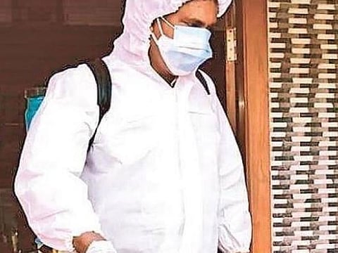 Latheef Kolath engaged in sanitisation work at a house in Edappal