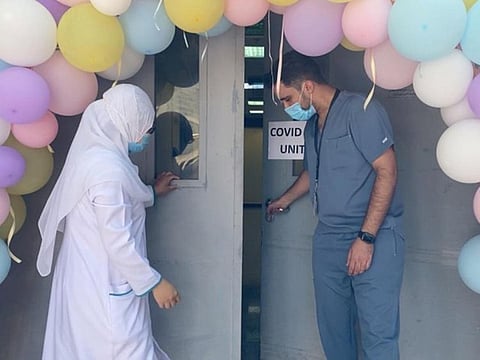 Hospital staff outside a COVID-19 unit in Saudi Arabia. The kingdom has recently expanded the inoculation campaign, urging citizens and expatriates to register to get vaccinated.